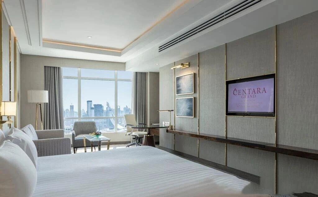 Centara Grand Hotel guest room featuring vertical gold stainless steel wall trim accents.