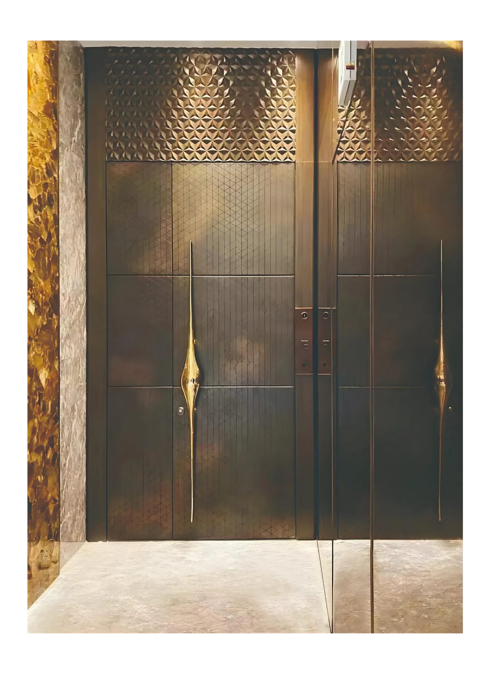 Bespoke dark bronze doors with etched panels and sculptural antique brass accents using custom patina metal finishes.