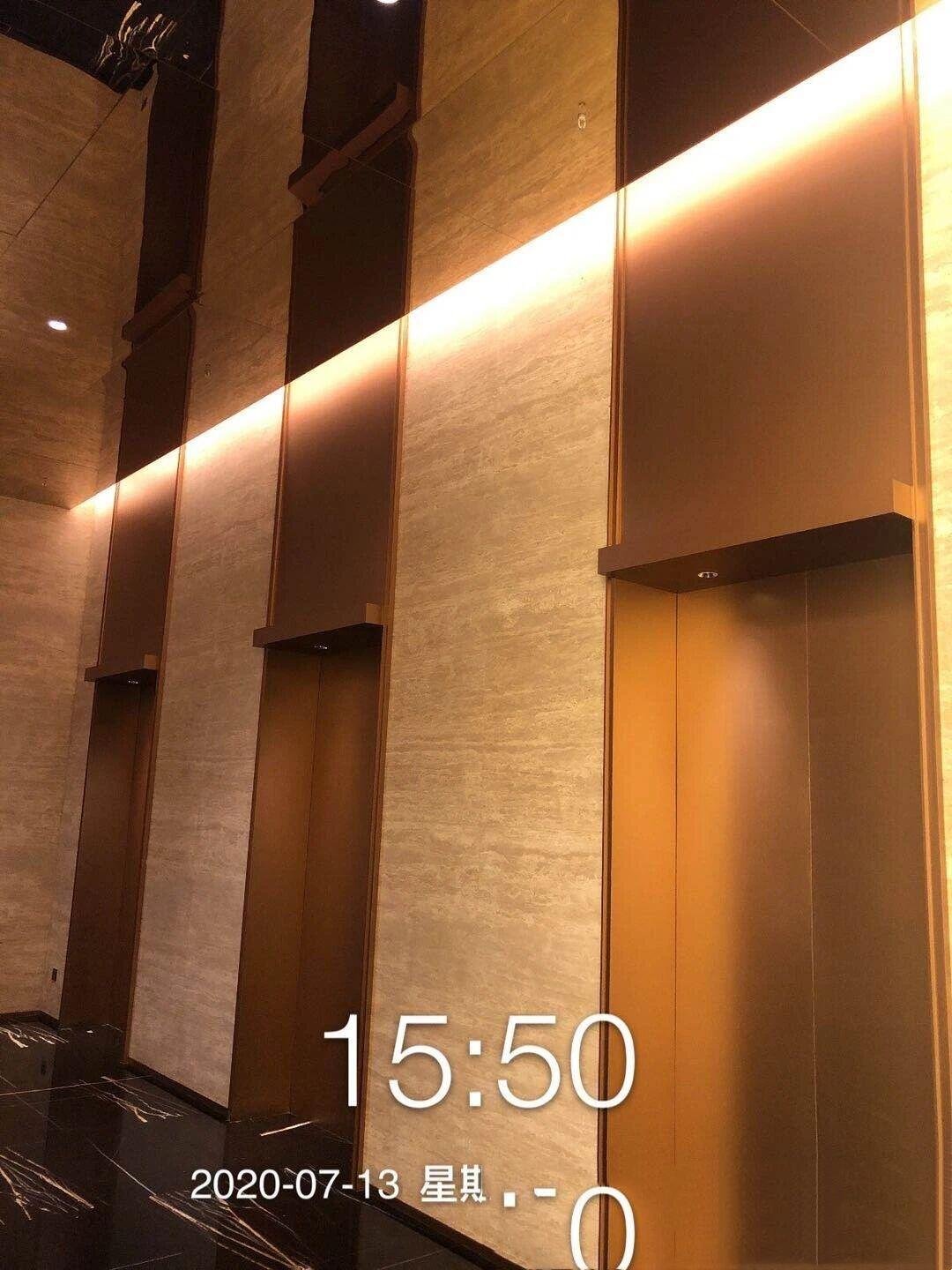 Stainless Steel Elevator Wall Panels with an antique bronze finish for luxury commercial elevator cabin interiors