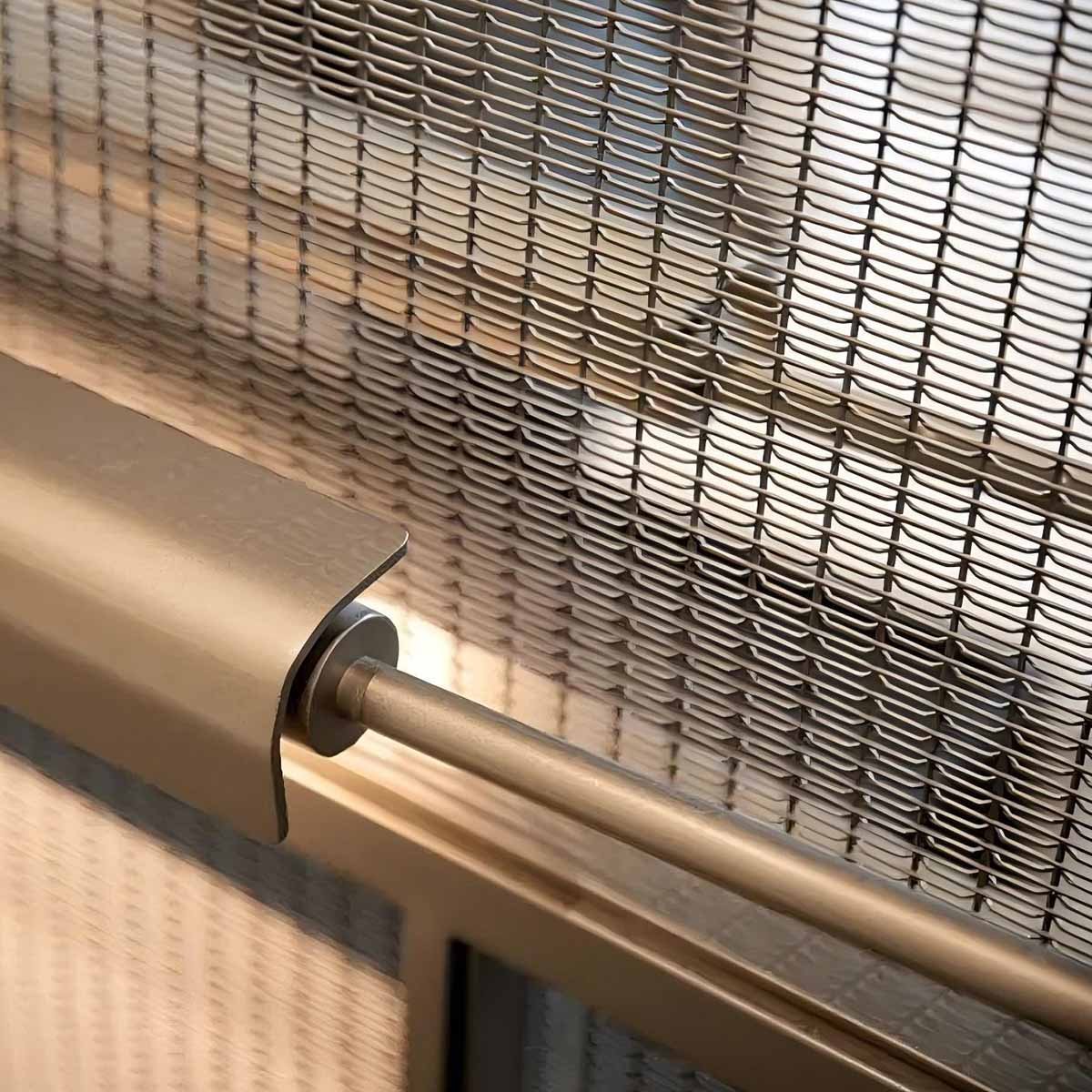 Close-up of stainless steel woven wire mesh used as balustrade infill panels for stair balustrades.
