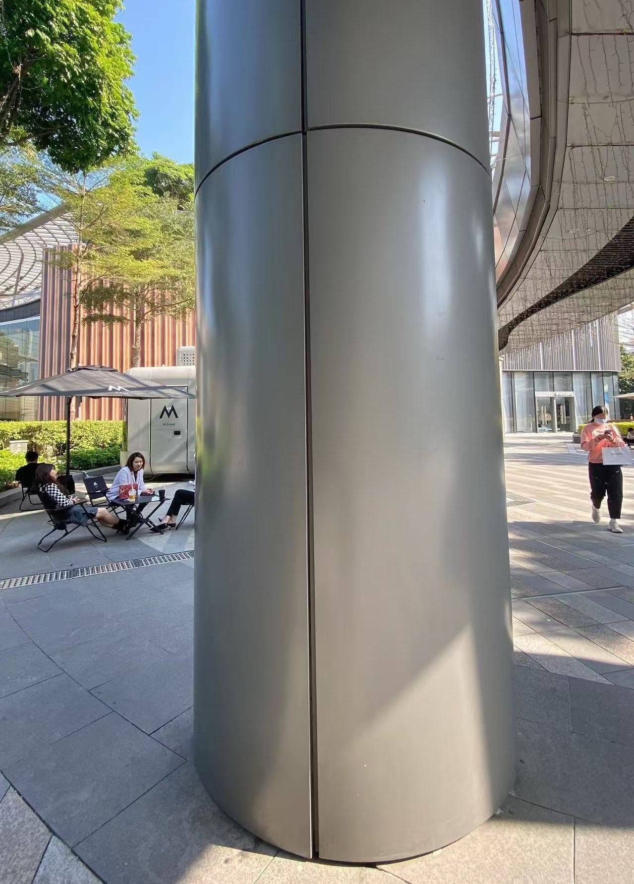 Sandblasted stainless steel sheets used for architectural column cladding, minimizing reflections and adding dimensionality to exteriors.