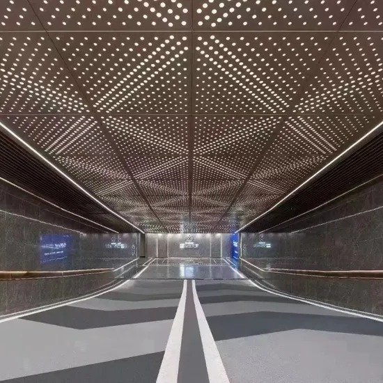 Backlit perforated aluminum ceiling panels for modern tunnel design, providing optimal airflow management and visual depth.