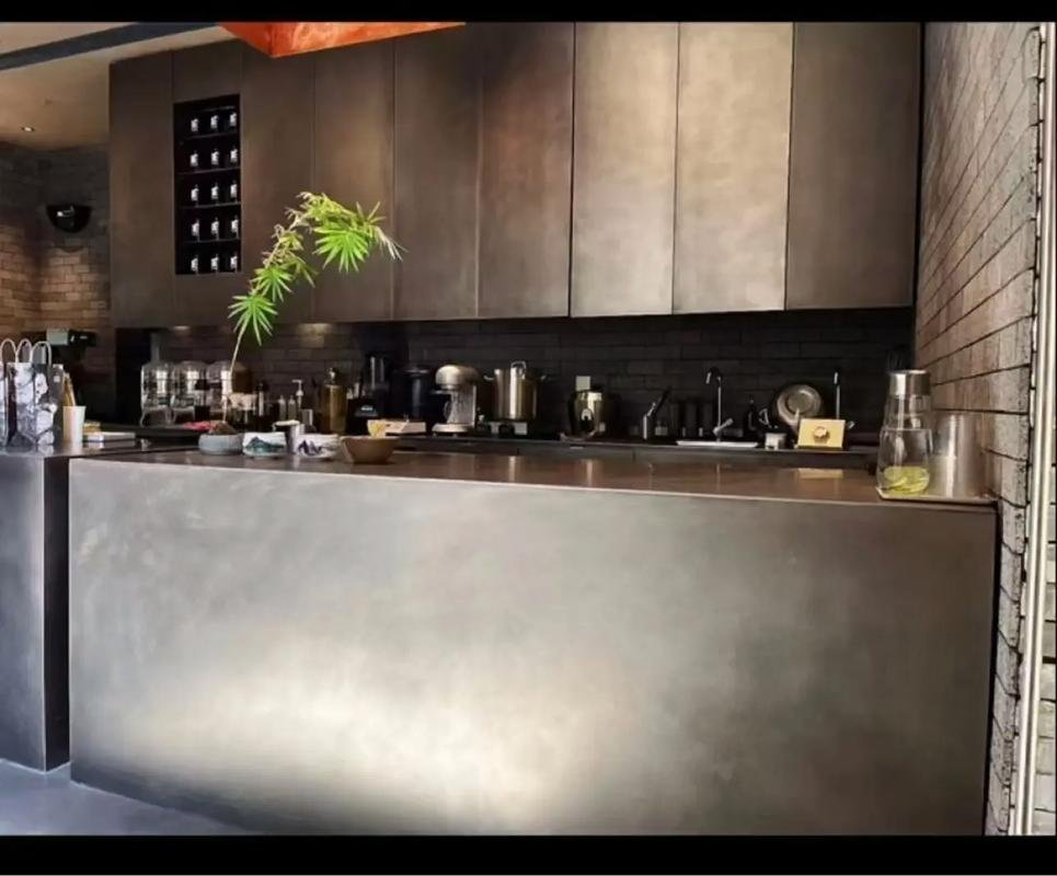 A bespoke etched patina metal panel with a decorative organic pattern, showcasing the precision artistry of XYC Metalworks.