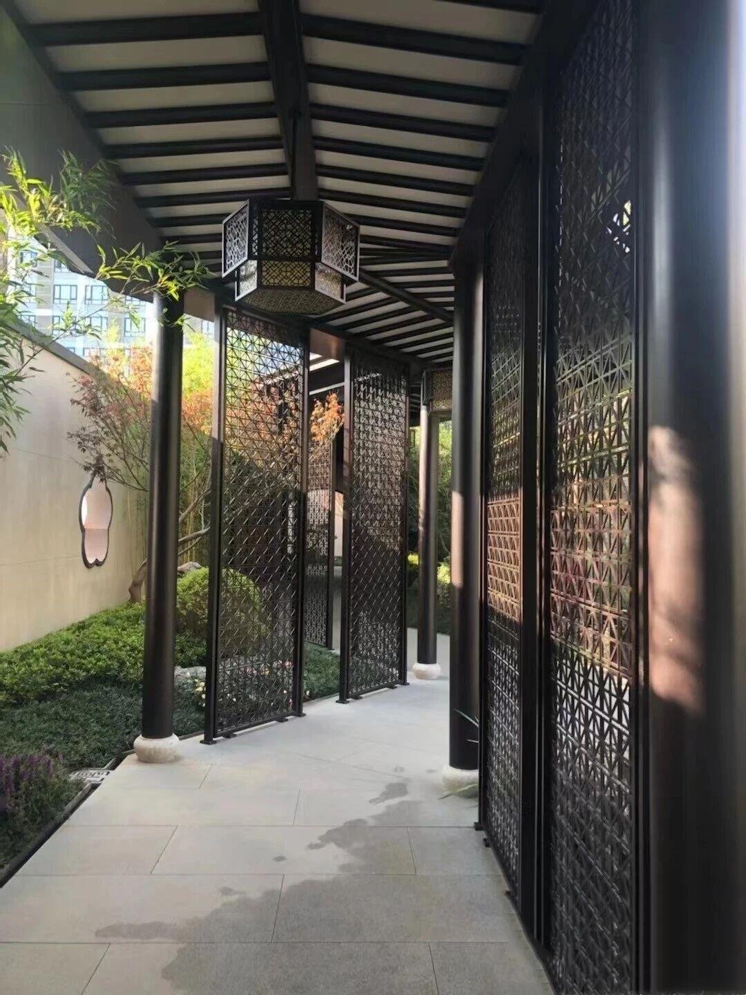 A custom Metal Pergolas in Chinese style, featuring a PVD coated black color stainless steel Pergolas and decorative perforated metal side screens