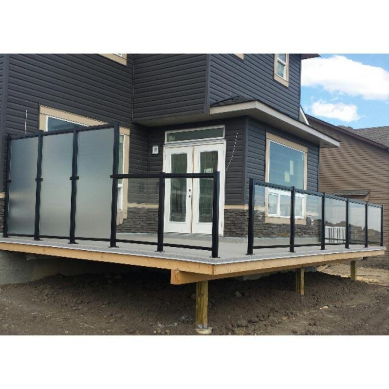 Weather-resistant black stainless steel railing with frosted glass panels for privacy and wind protection on an outdoor patio.