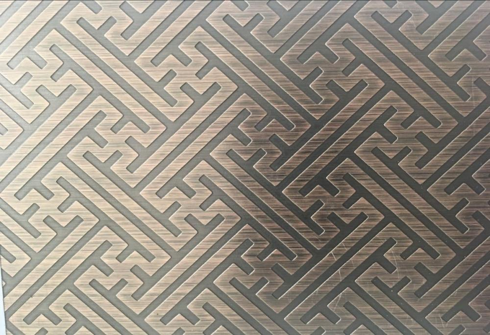 Bronze PVD coated etched stainless steel sheets with a geometric pattern for architectural facades and screens.