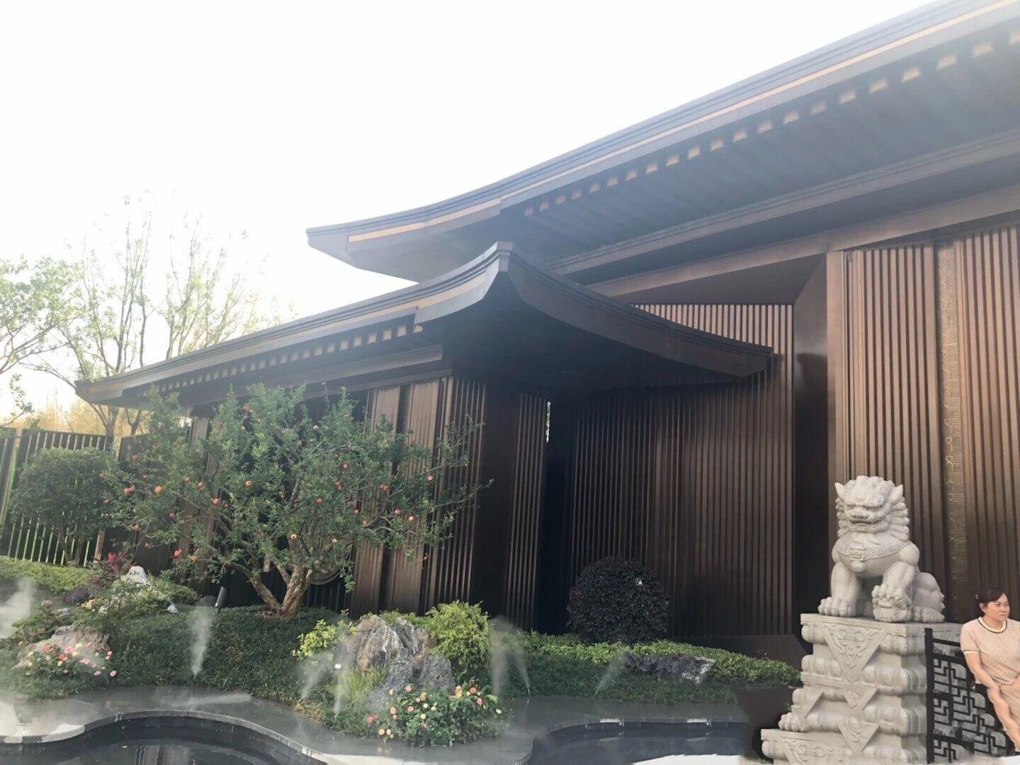 Bronze-finished Stainless Steel Custom Cladding Systems creating durable Architectural Metal Facades with a traditional Chinese aesthetic.