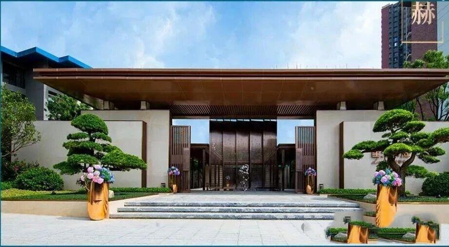Custom stainless steel entrance canopy with an antique bronze finish, featuring bespoke metal cladding for a luxury estate gate.