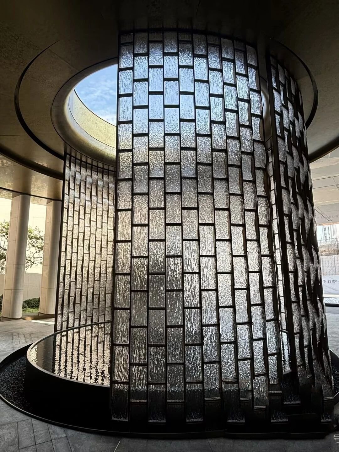 Architectural Metal Partitions and circular decorative screens featuring a unique textured design for luxury interior space division