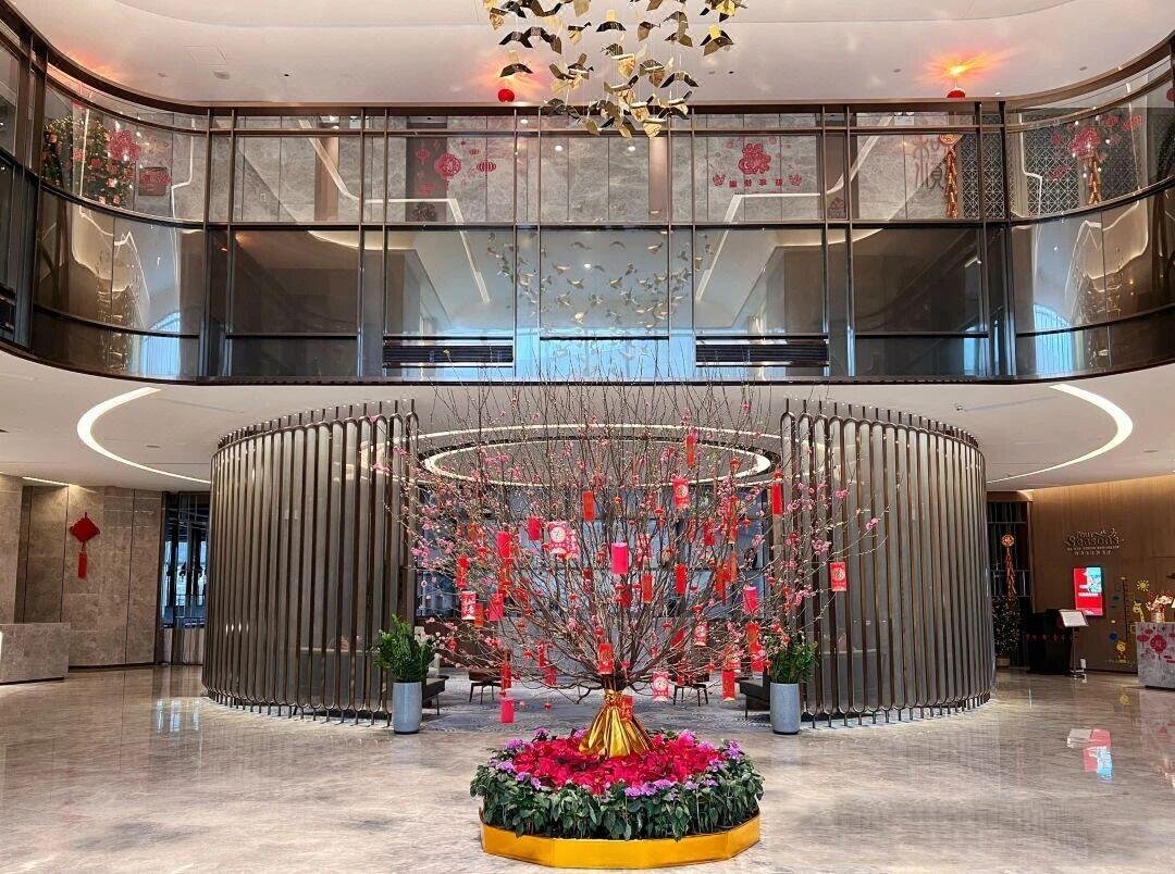 Architectural Metal Partitions featuring a unique circular vertical slat design as a central artistic feature in a commercial lobby