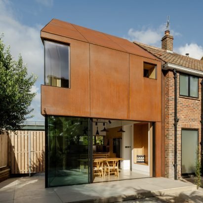 Residential house extension featuring a modern Corten steel architectural facade for a rustic, maintenance-free look.