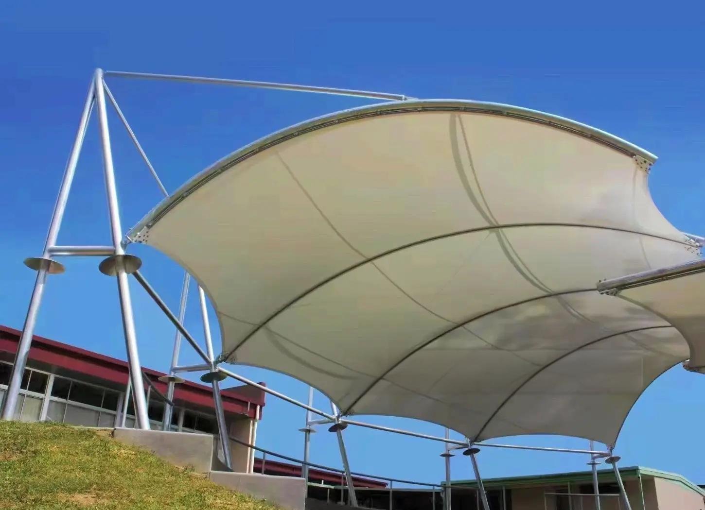 Elegant curved walkway canopy structure utilizing high-performance custom PVDF powder coated aluminium sheets.