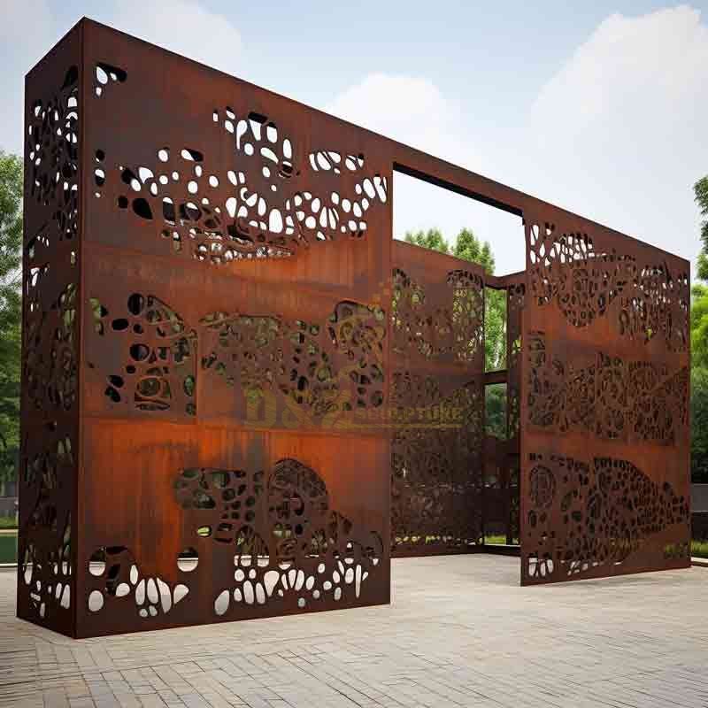 A large-scale laser-cut sculpture demonstrating expert custom Corten steel fabrication for public art installations.