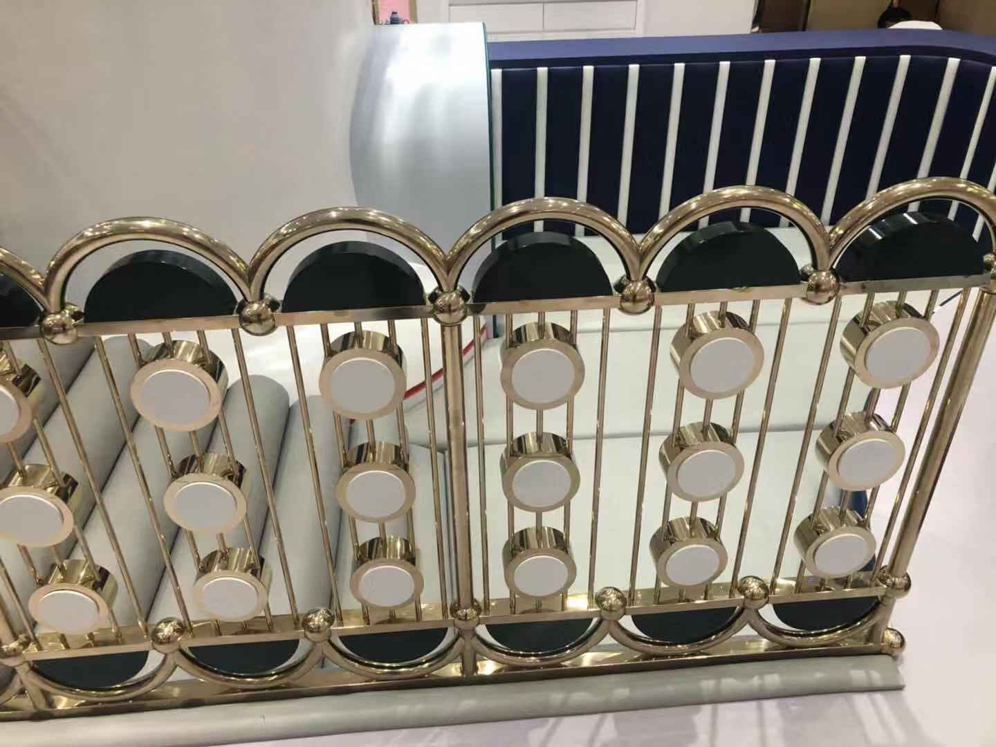 Architectural Balustrades and Stainless Steel Railing Systems with a custom black and gold finish featuring geometric ornate detailing for a luxury club interior