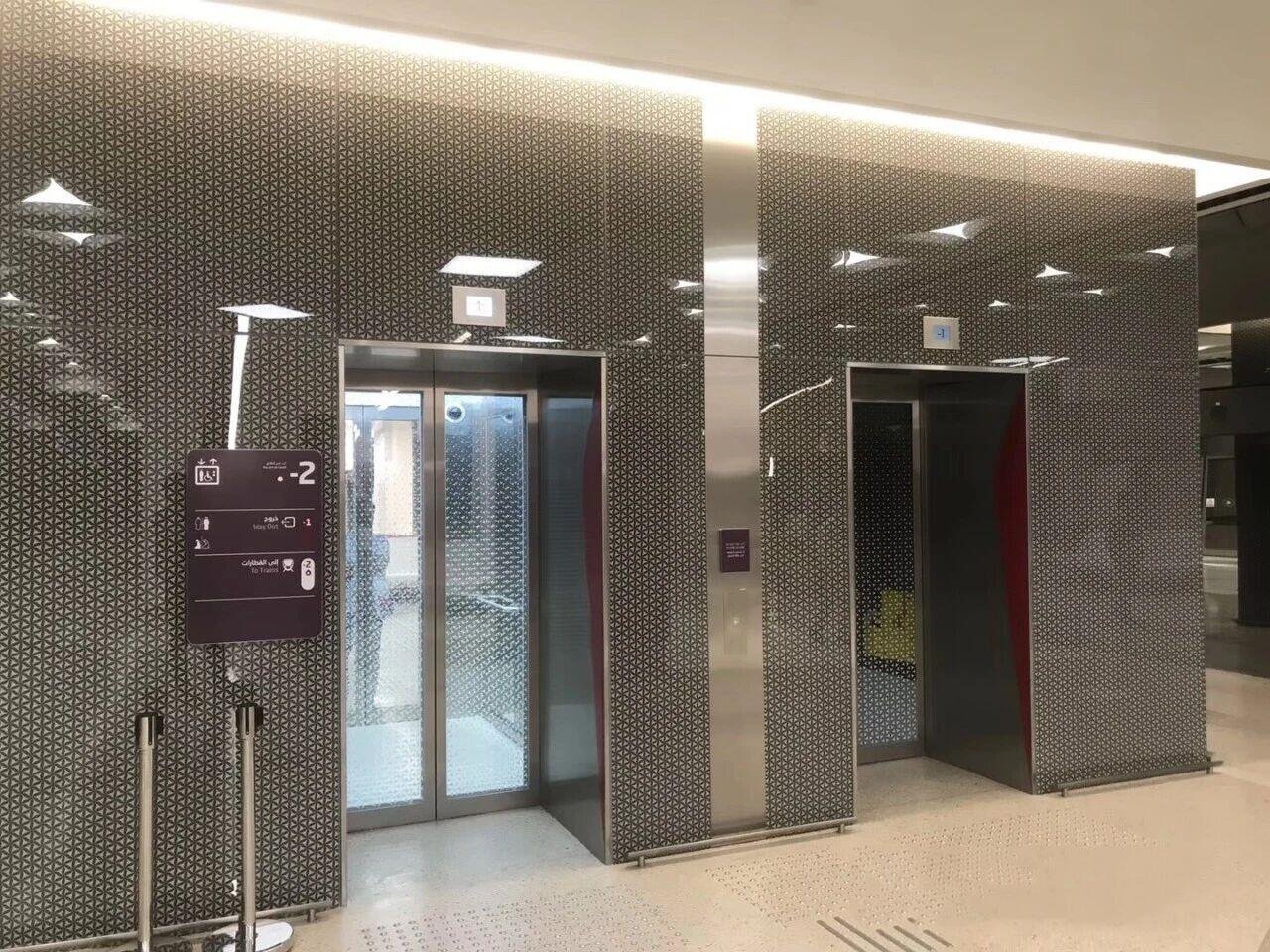 Etched finish Stainless Steel Elevator Wall Panels and door skins featuring decorative architectural metalwork for a commercial tower