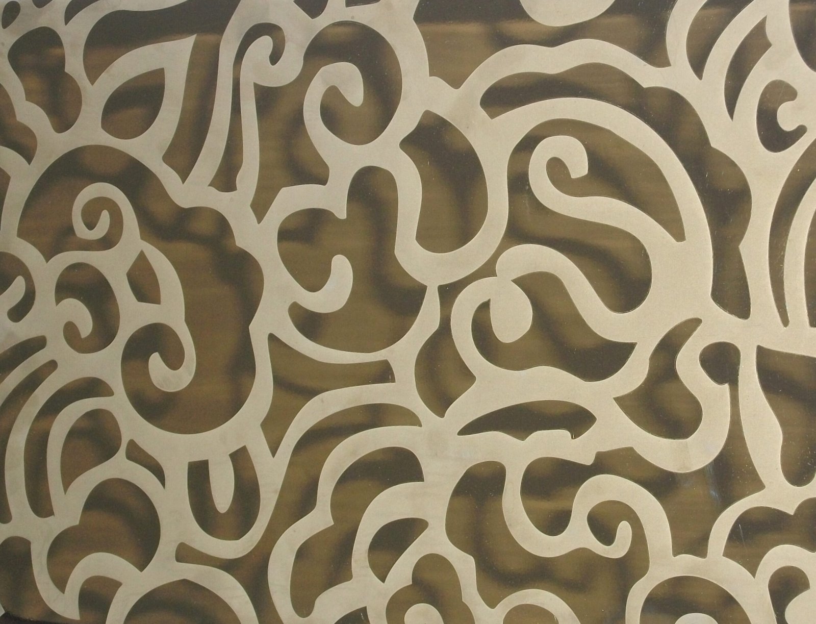 Decorative etched stainless steel sheets with nature-inspired motifs for high-end hospitality and retail environments.
