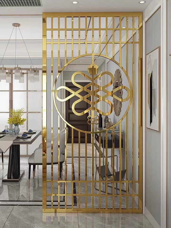 High-precision gold-finished laser-cut stainless steel sheets for a decorative dining area screen featuring circular motifs.