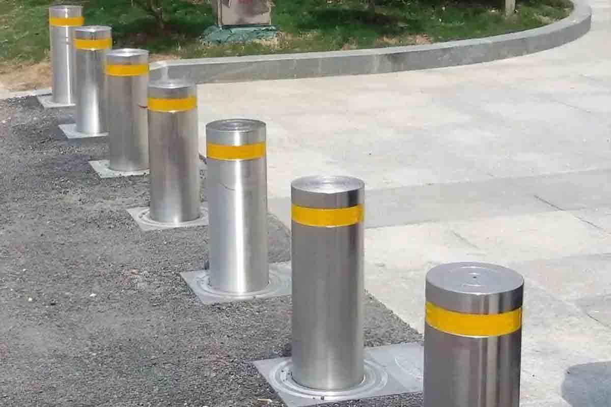 Impact-resistant stainless steel safety bollards with high-visibility yellow bands, ideal for protecting pedestrians and infrastructure in high-traffic urban zones.