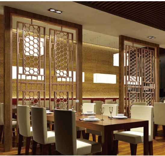 Intricate honeycomb pattern laser-cut stainless steel sheets used as decorative dividers in a high-end restaurant interior.
