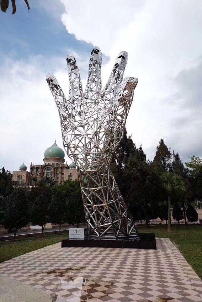 Large scale geometric wireframe stainless steel hand sculpture for outdoor public park