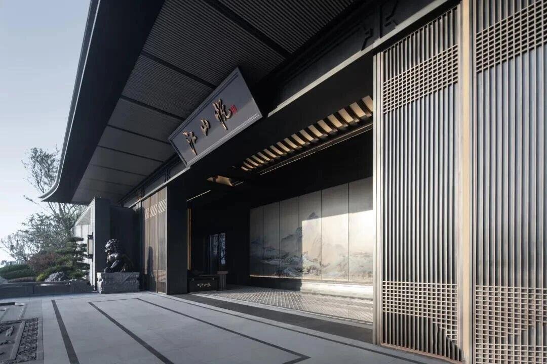 Grand architectural entry featuring heavy-duty stainless steel entrance canopies with louvered soffits, representing our diverse range of metal canopies & custom awnings and glass & aluminum awnings.