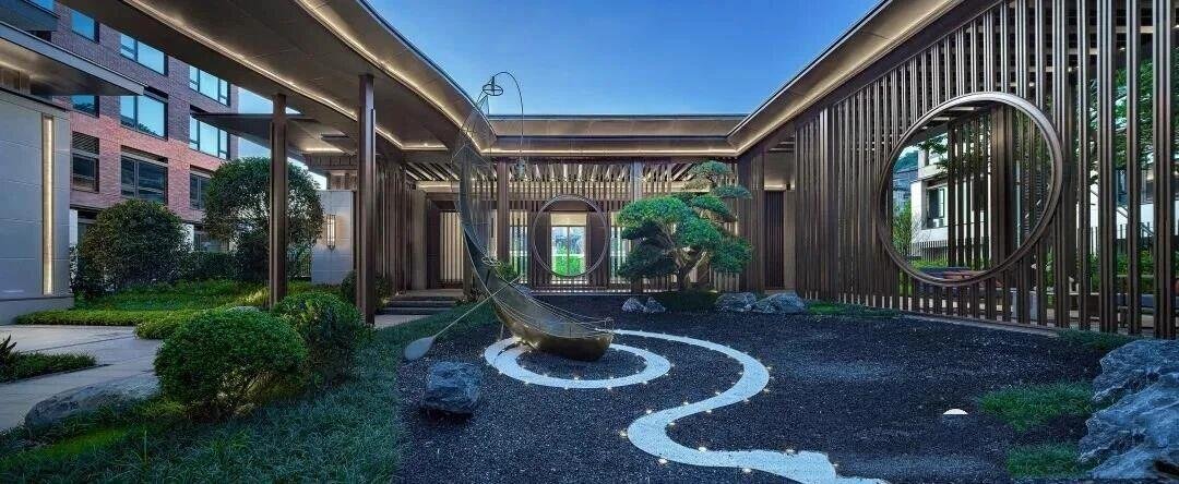 A modern sandblasted stainless steel with PVD brozen color pergola with a stainless steel louvered roof and sculpture