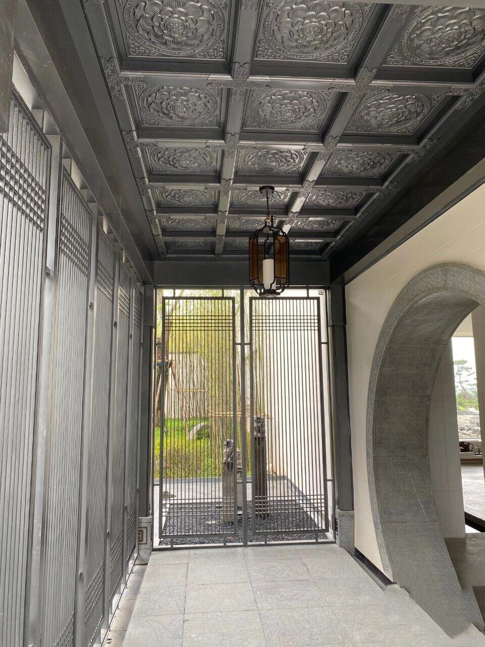 Architectural Metal Ceiling Systems with ornate floral relief patterns and coffered square metal tiles for traditional decor