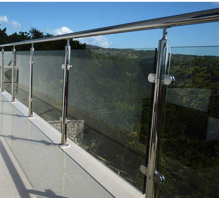 Custom outdoor stainless steel balustrade with glass panels and 316 marine-grade posts for a residential balcony.