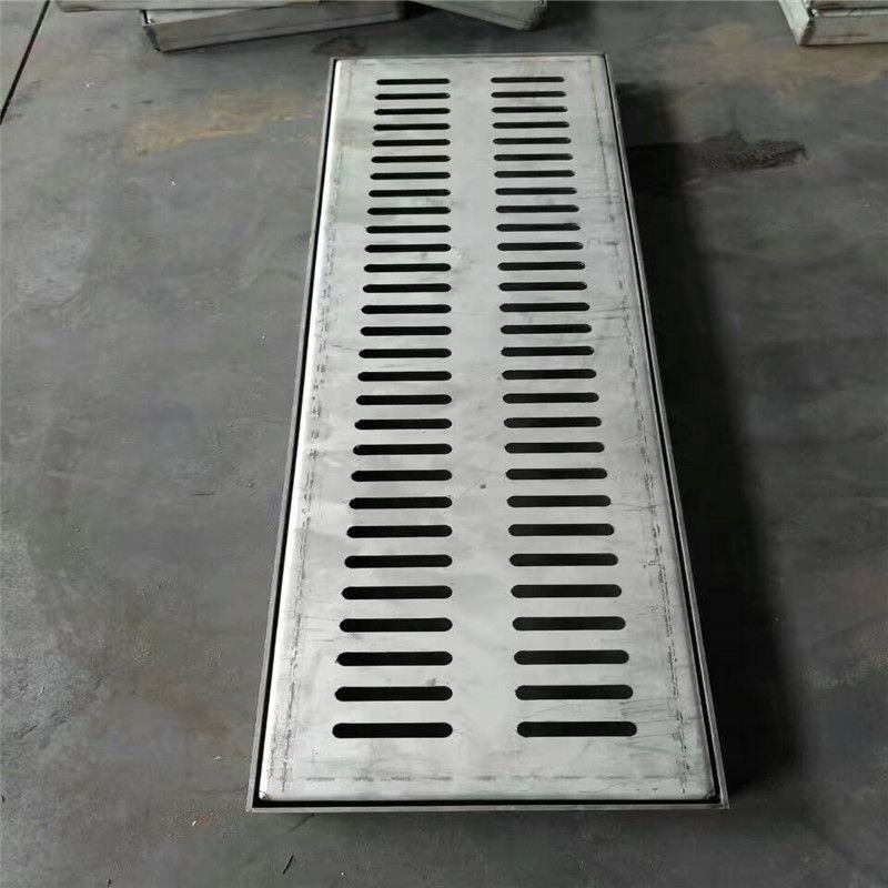 Rectangular slip-resistant perforated grating plate crafted from durable stainless steel for heavy-load zones.