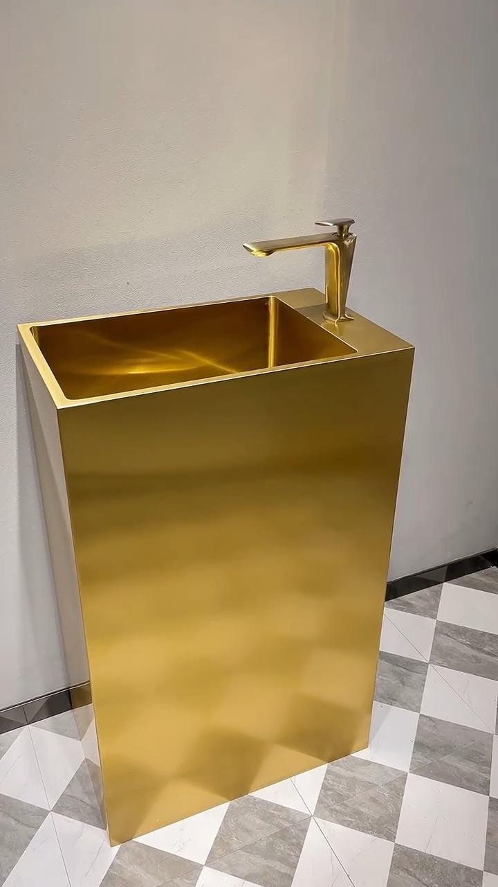 Sandblasted stainless steel sheets featuring a premium gold PVD finish applied to a bespoke luxury bathroom sink basin.