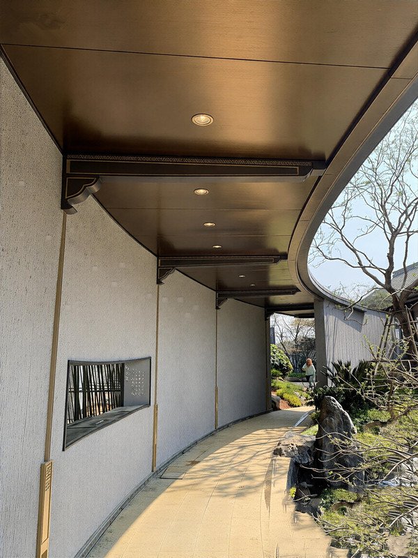 Satin finish stainless steel sheets used for upscale outdoor walkway ceiling accents, combining durability with lasting functionality.