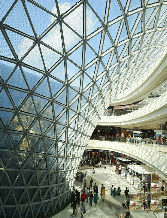 Custom Cladding Systems and complex Architectural Metal Facades engineered for a large-scale shopping mall atrium structure.