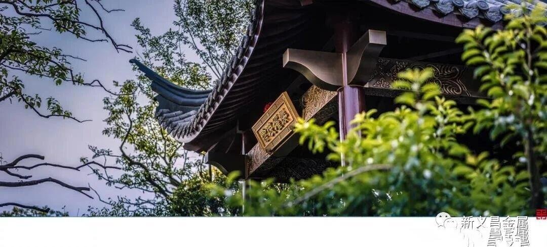 Detailed view of a traditional Chinese metal pavilion roof with custom-fabricated flying eaves in a dark bronze finish.
