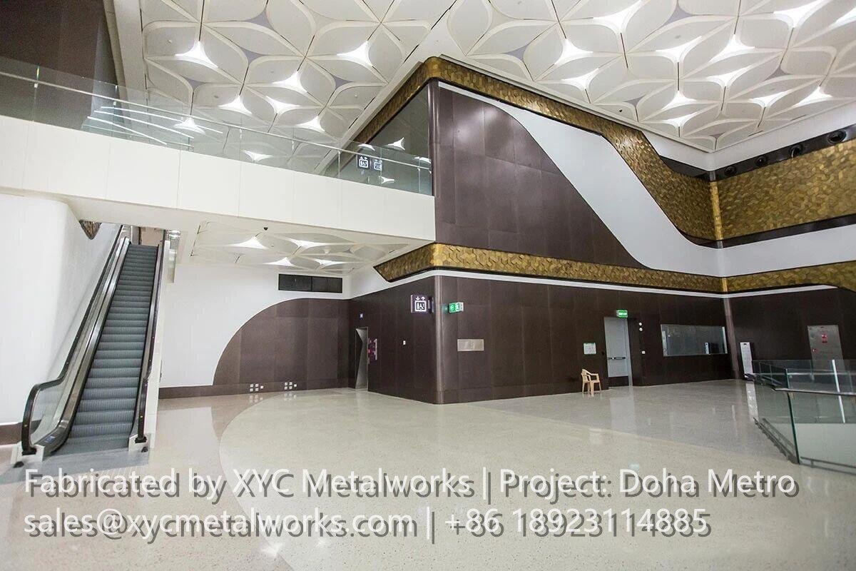 Architectural metal column cladding and interior finishes by XYC METALWORKS at a Doha Metro station platform.