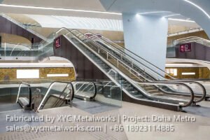 Wide view of the Doha Metro concourse featuring integrated metal balustrades and architectural finishes by XYC METALWORKS.