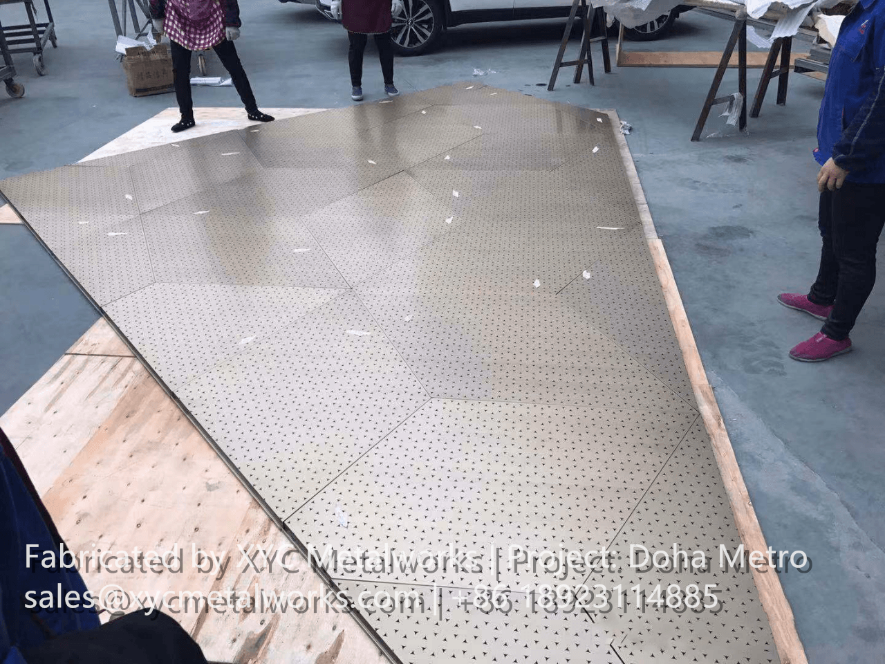 Pre-assembly and fit-test of custom triangular perforated metal panels at XYC METALWORKS factory for Doha Metro