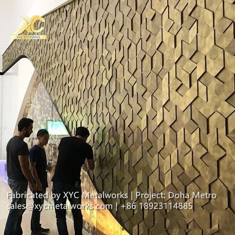 Wide view of the Doha Metro concourse featuring integrated metal balustrades and architectural finishes by XYC METALWORKS.